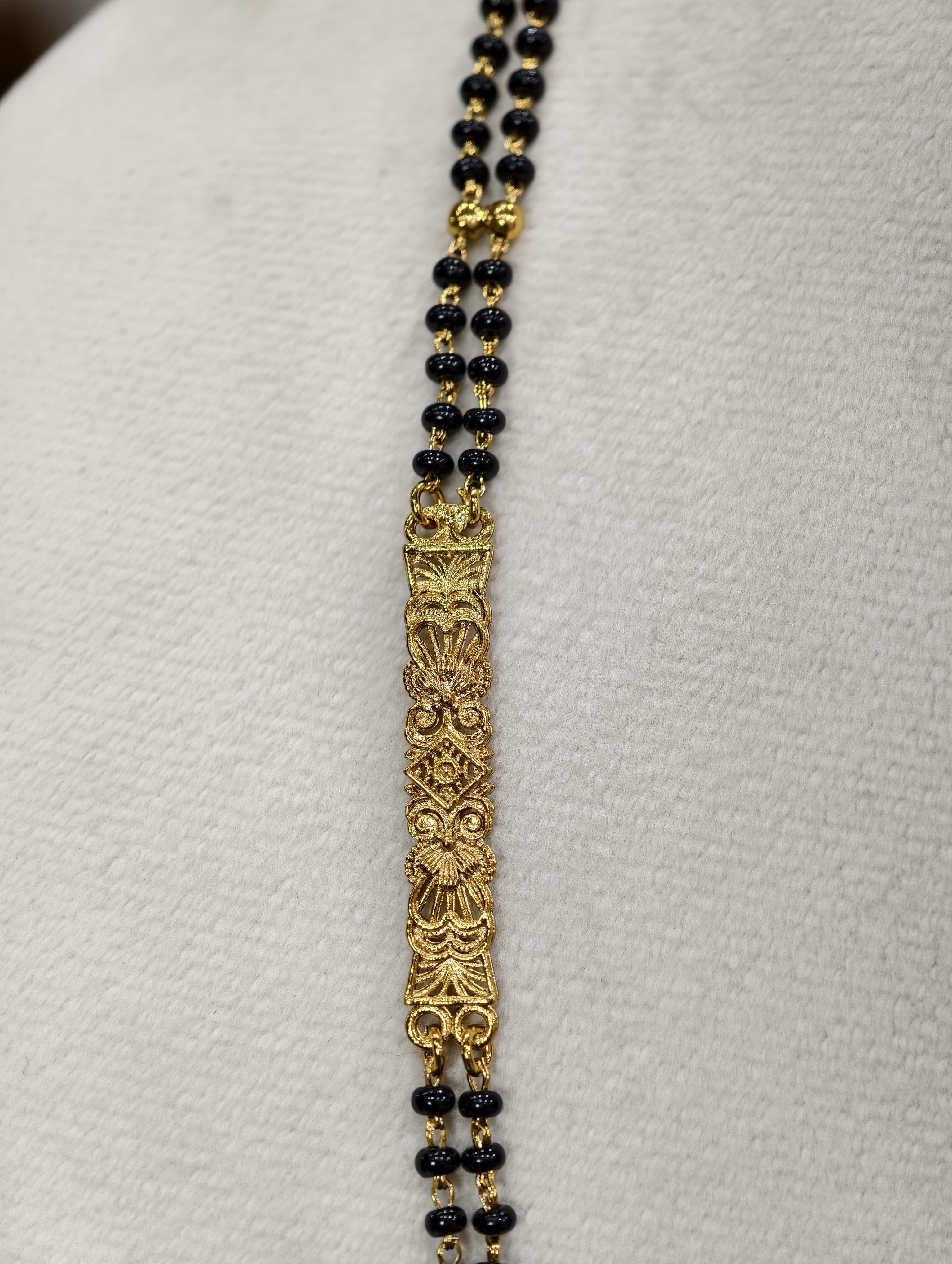 Gold Model Long Black Beads